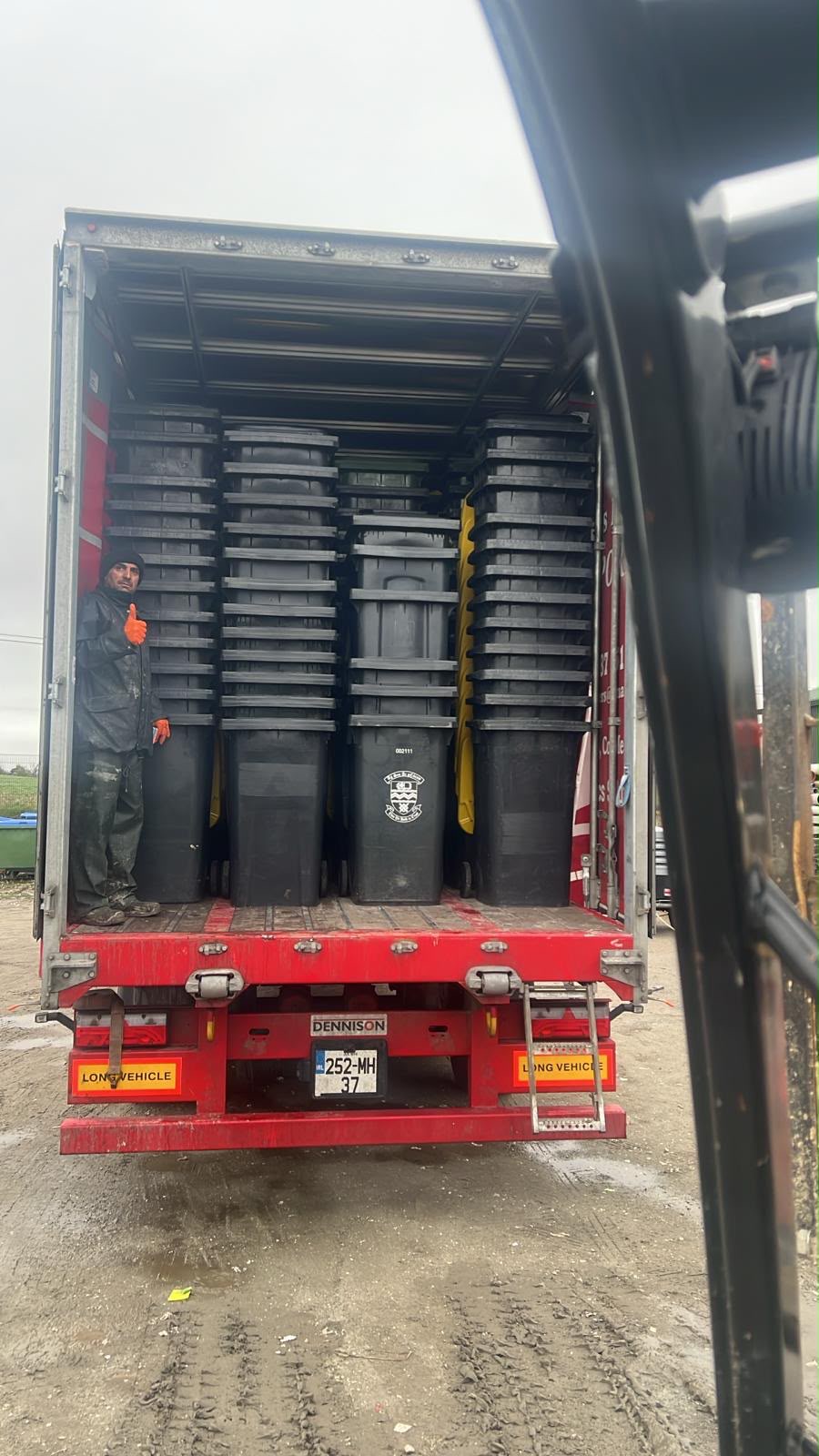 Clean wheelie bins lined up at a depot ready for redistribution